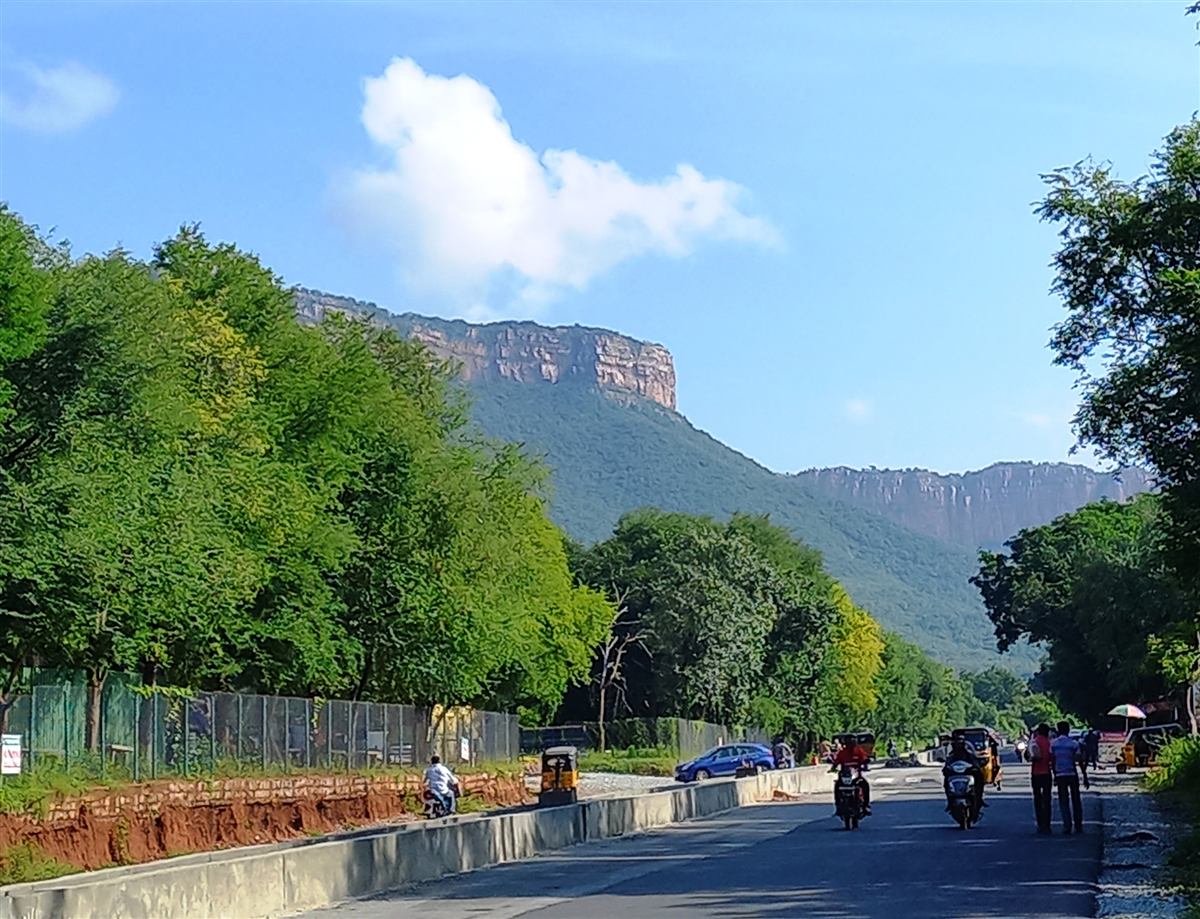 Panoramic scenic view of the sacred Tirumala hills surrounding the town under morning sunlight